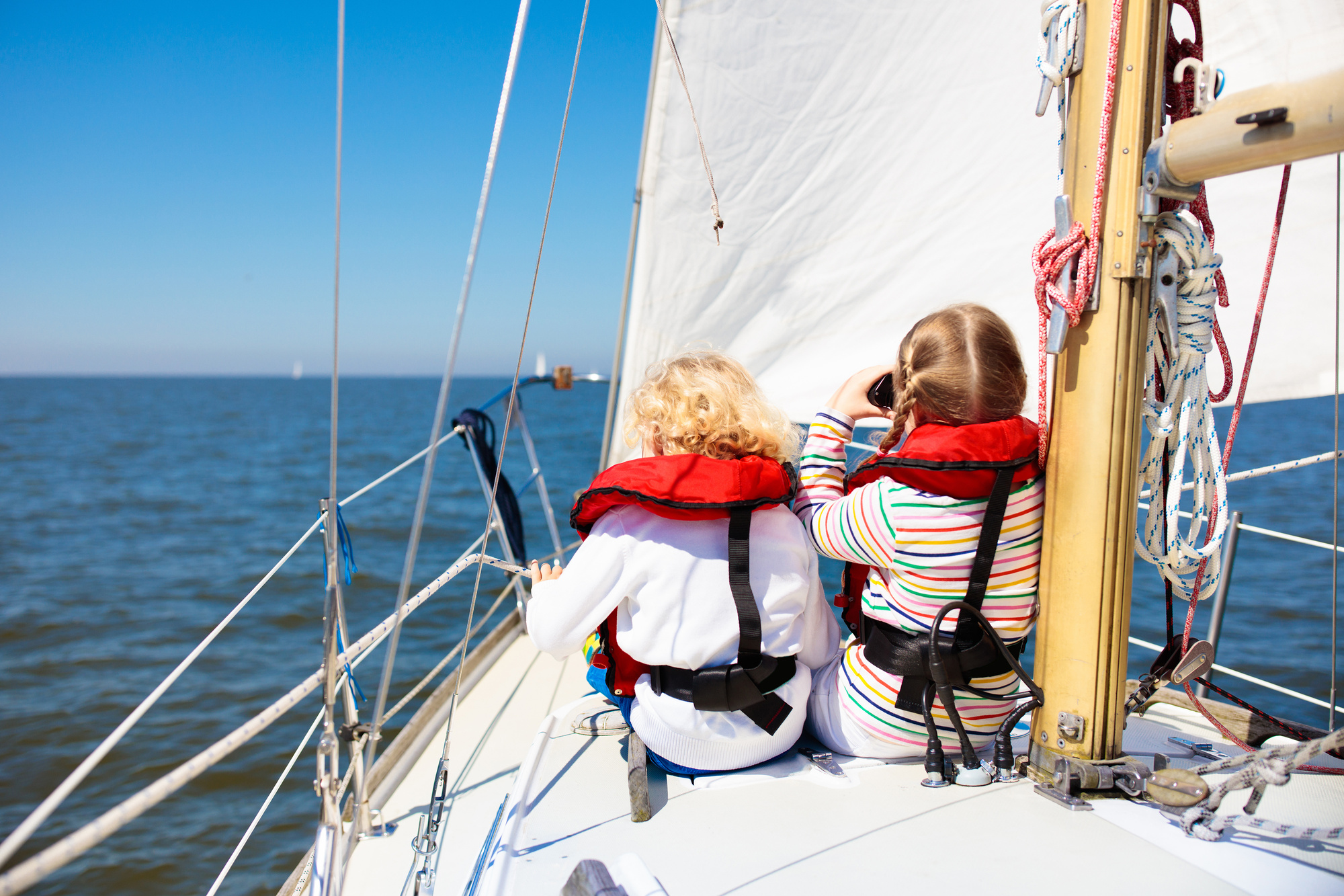 Kids sail on yacht in sea. Child sailing on boat.